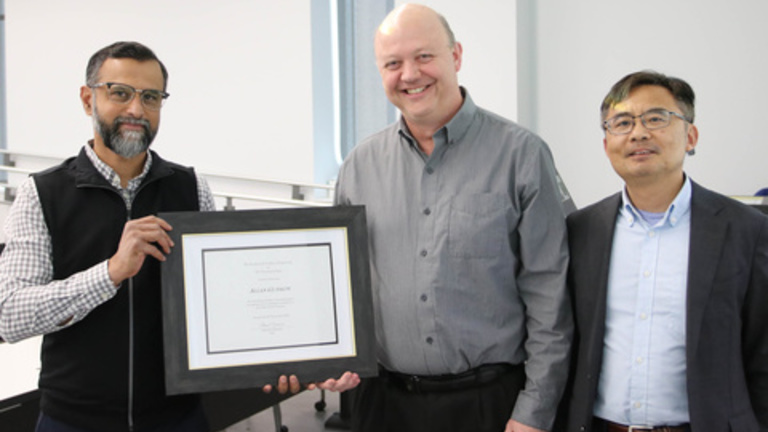 Professors Udaykumar, Guymon, and Wang pose for a photo